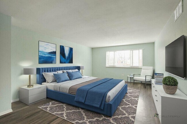 Elegant bedroom with a plush blue bed, modern decor, large window, and stylish artwork creating a serene atmosphere. - LaRonja Apartments