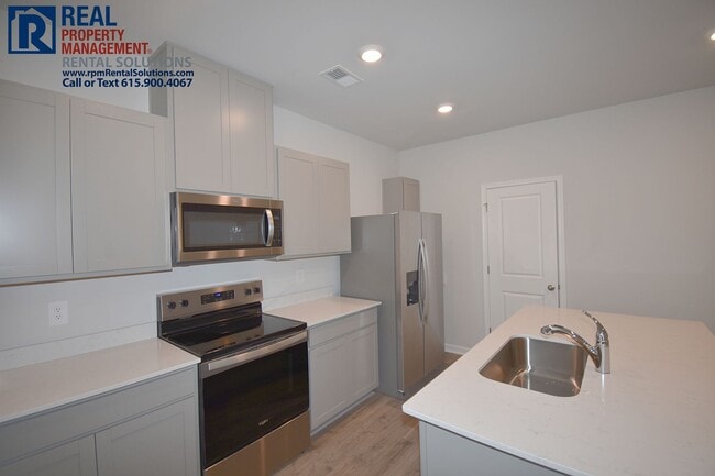 Photo - Like new 3bd townhome w/ attached 2 car garage & community pool! Washer/dryer included!