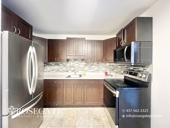 Photo - Pet-Friendly 3-Bedroom Stacked Townhome with Garage & Backyard in London Unit 21