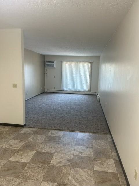 Open concept Living Room to Kitchen/Dining area - River Garden Apartments