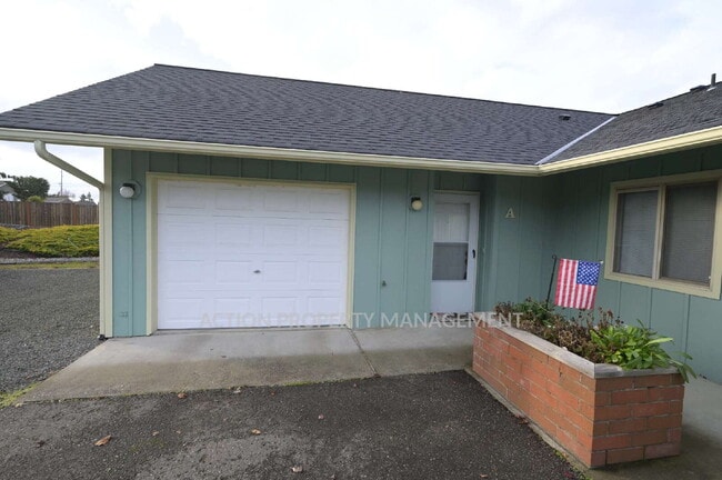 Photo - 2 bed, 2 bath, 1 car garage- water, sewer and yard care included! Unit A