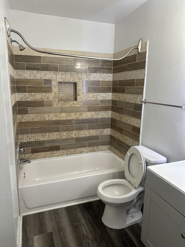 Hall bath with linen closet and lighted mirror - 5384 Bedford Ter Unit Clusters at Woodlawn