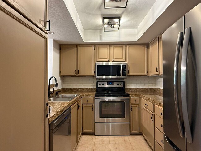 Photo - Spacious 2-Bedroom Ground Floor Condo with Private Yard in Kirkland Unit L105