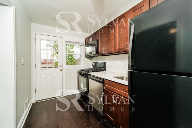 Photo - The living is easy in this 4 bedroom, 2 bathroom townhome