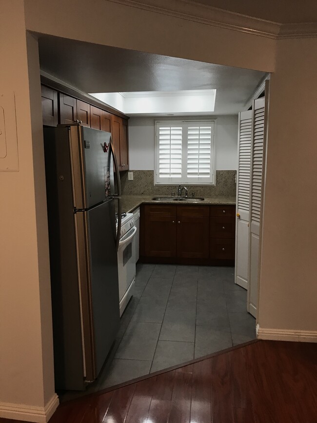 Kitchen - w/ fridge and laundry included - 618 Howard N St Condo Unit #