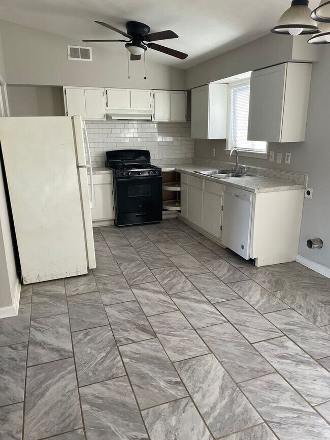 Photo - 3BR 1BA Home w/ Fenced Backyard & Patio • Stove-Ready Kitchen • Carport in Memphis