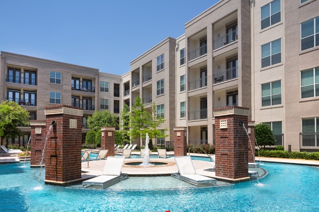 Resort-style swimming pool with tanning areas - ICON at Ross Apartments