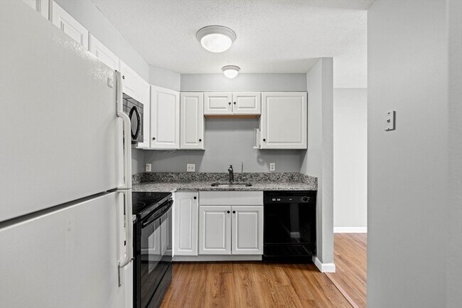 Photo - Updated 1BR Condo with Balcony, Garage Parking & Storage Near Commuter Rail Unit 101