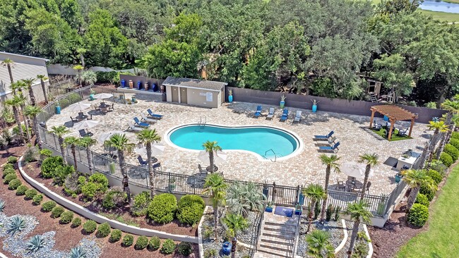 Experience indulgence on our sprawling sundeck surrounding our exclusive resort-style community pool. - The Fairpointe at Gulf Breeze Apartments