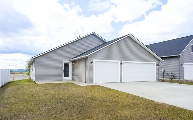 Photo - Newly built home with 3 car garage