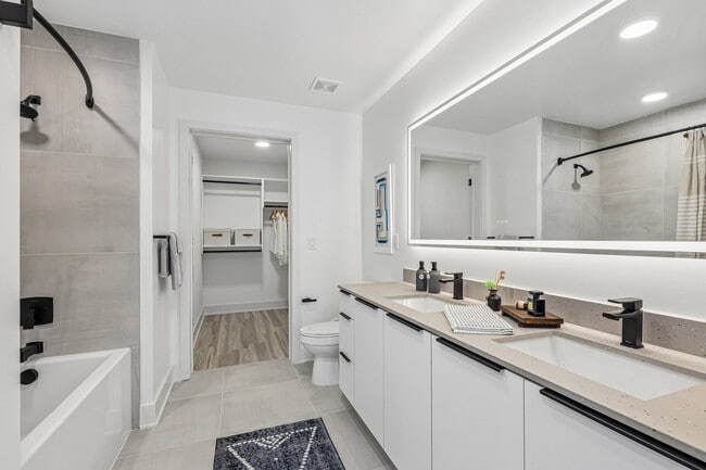 Dual bathroom vanities with quartz countertops