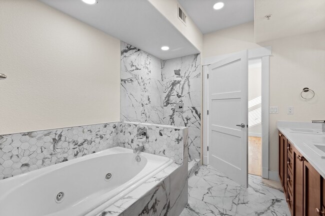 bathtub and shower - 1080 E 13th Ave Unit 301