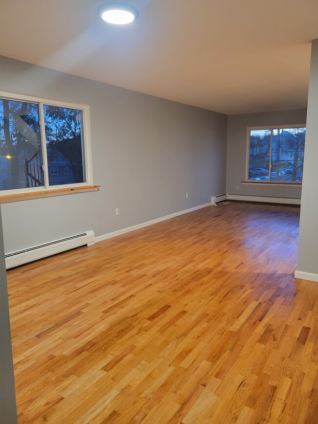 Open Dining Room with hardwood floors extending into Living Room - 103 Prescott Ave