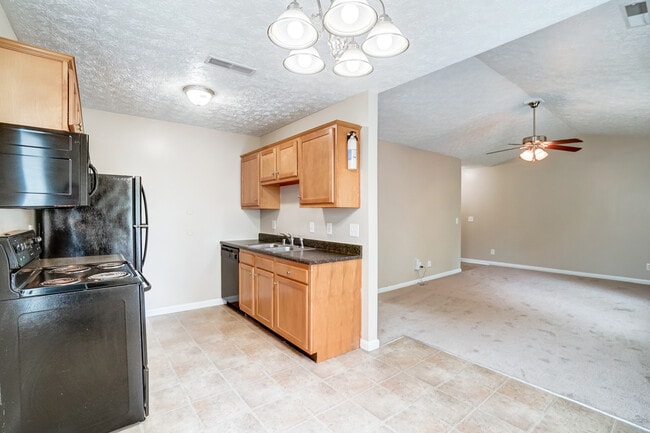 Kitchen with view of living room