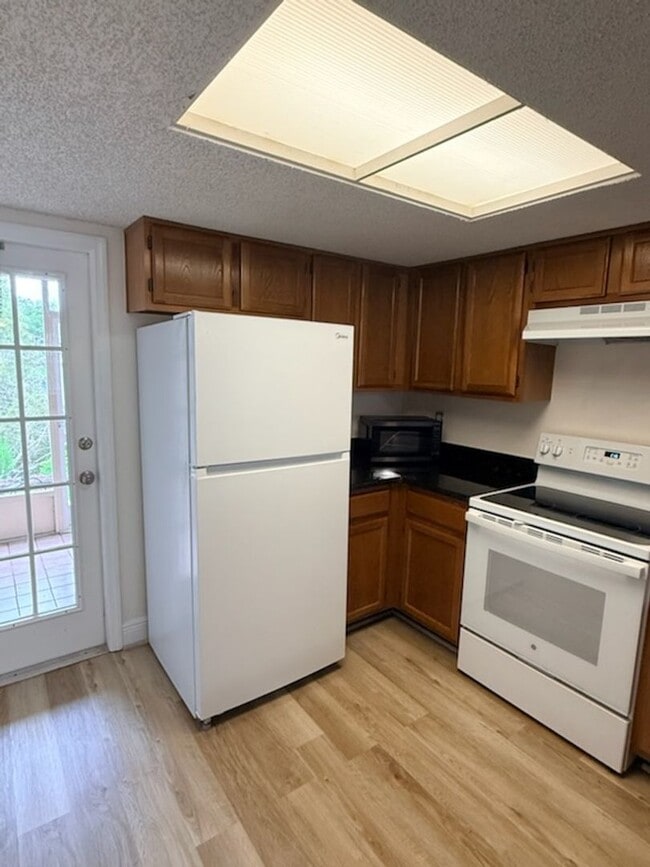 Photo - 2 BR/3BA | Newly Renovated Single Family Home | Community Pool | Private back porch!