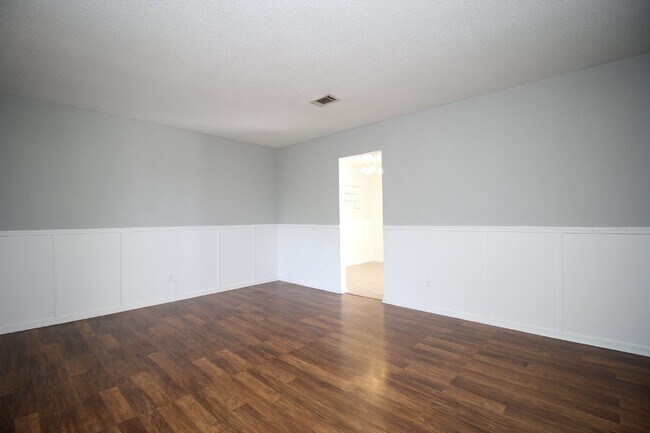 Photo - Spacious 3BR/1.5BA Home in Pace with Open Living Area, Tiled Family Room, and Fenced Backyard – M...