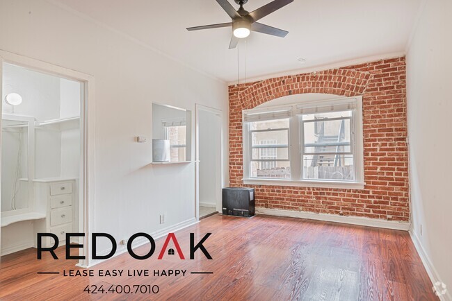 Building Photo - Welcoming Studio with Exposed Red Brick, H... Unit 107 Rental