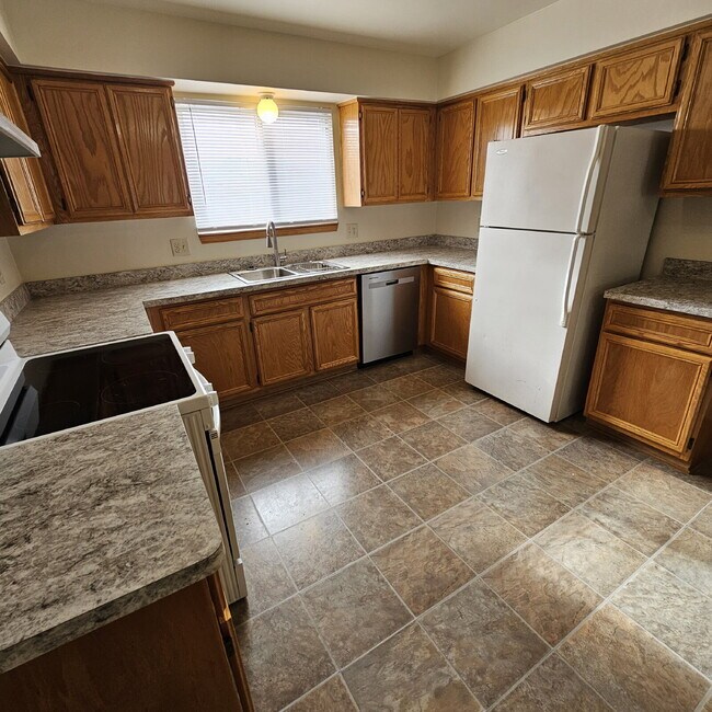 Photo - 2 Bedroom Upper Condo w/ Open Kitchen to Living Room Space. All Appliances Included along with Wa...