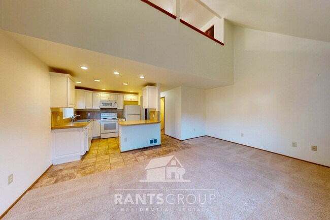 Photo - Lovely pet-free end unit in an established...