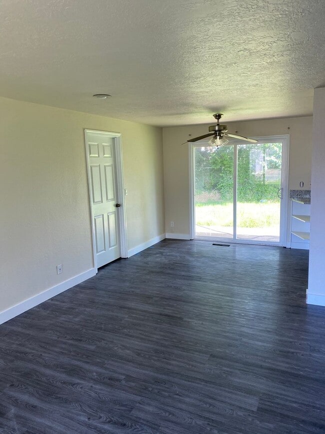 Photo - 4 Bedroom, 2 Bathroom House with Large Fenced Backyard, New Vinyl Plank Flooring, Granite Counter...