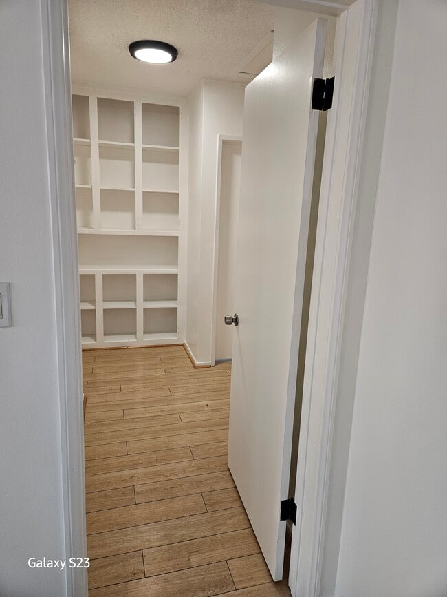 Hallway to bedrooms and linen closet - 1344 E Windsor Rd Unit A/front