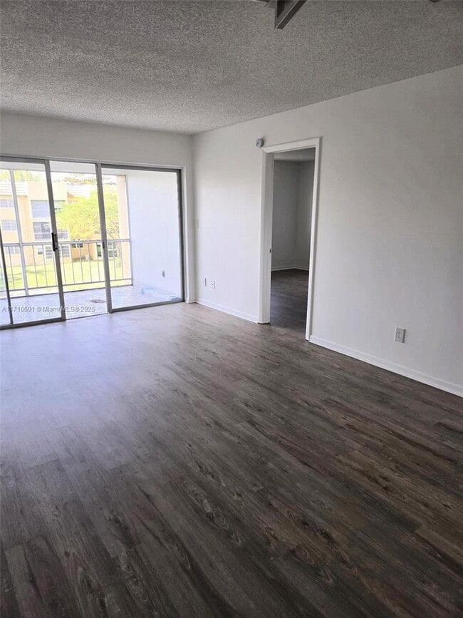 Building Photo - 5860 NW 64th Ave Unit 311 Rental