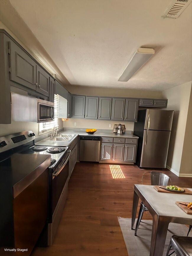 Step into the inviting kitchen of Guest House, featuring modern stainless steel appliances and spacious countertops ideal for culinary adventures. Enjoy the warmth of natural light that enhances the welcoming atmosphere. Schedule your visit today!