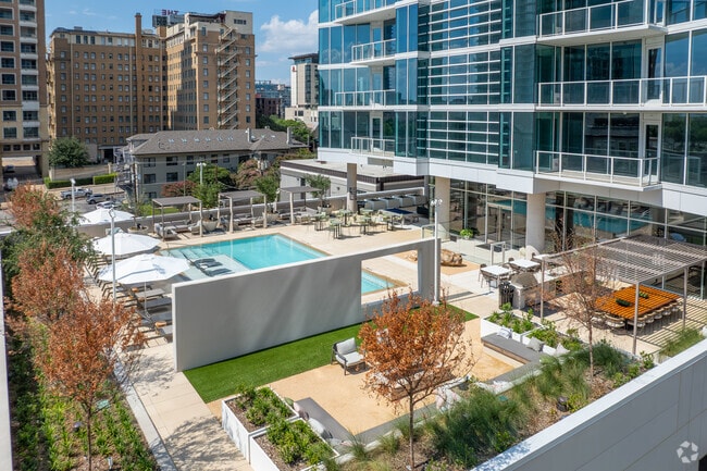 Resort-style pool deck with cabanas and fire pit - 2811 Maple