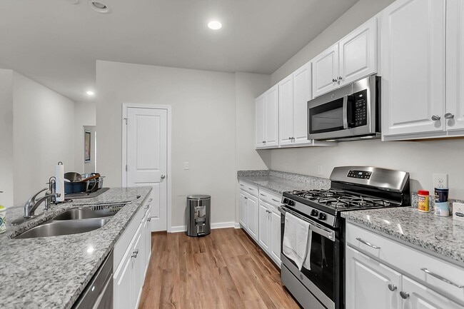 Photo - Spacious 4-Bedroom Home with Modern Upgrad...