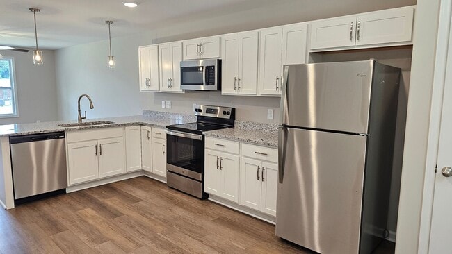 Photo - Built in 2024! Close to downtown 2 Bed/2.5 Bath. Nice private backyard with trees