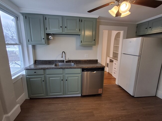 Kitchen features brand-new vinyl plank flooring and dishwasher. - 13 Mulberry St Unit #2