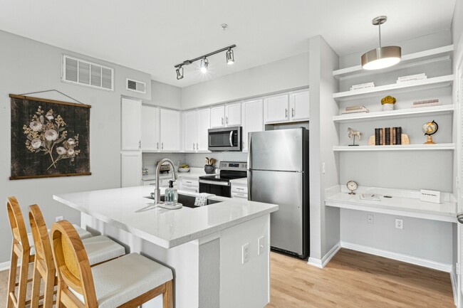 Large Kitchen with Desk Area and Kitchen Island - The Henry at Woodland Hills Apartments