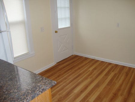 Kitchen from doorway off living room, next to closet. Door leads to deck. - 522 E Market St Unit 522