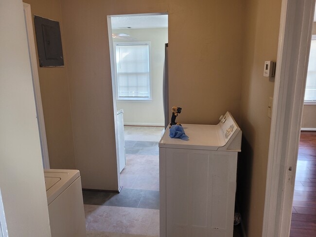 Laundry looking into the kitchen living room to the right - 115 Thomas Blvd
