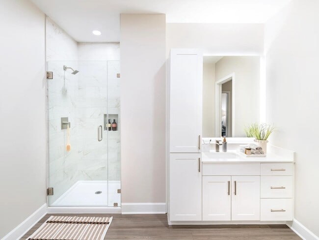 Indulge in luxury at Modera Waugh! Our designer bathrooms boast quartz countertops, dual vanities, and sleek LED mirrors, complemented by frameless glass showers.