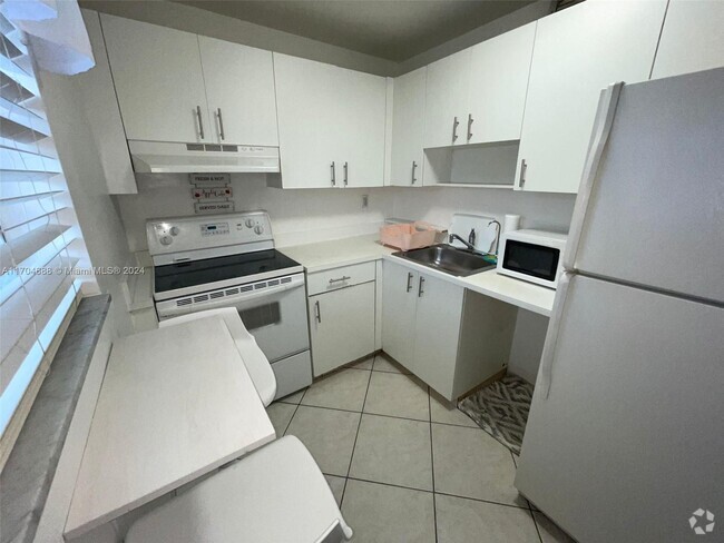 Building Photo - 6195 W 18th Ave Unit G324 Rental