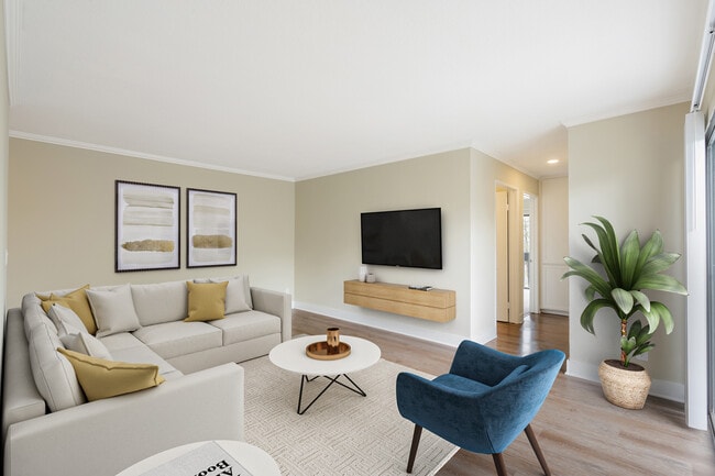 Renovated Package I living room with hard surface flooring