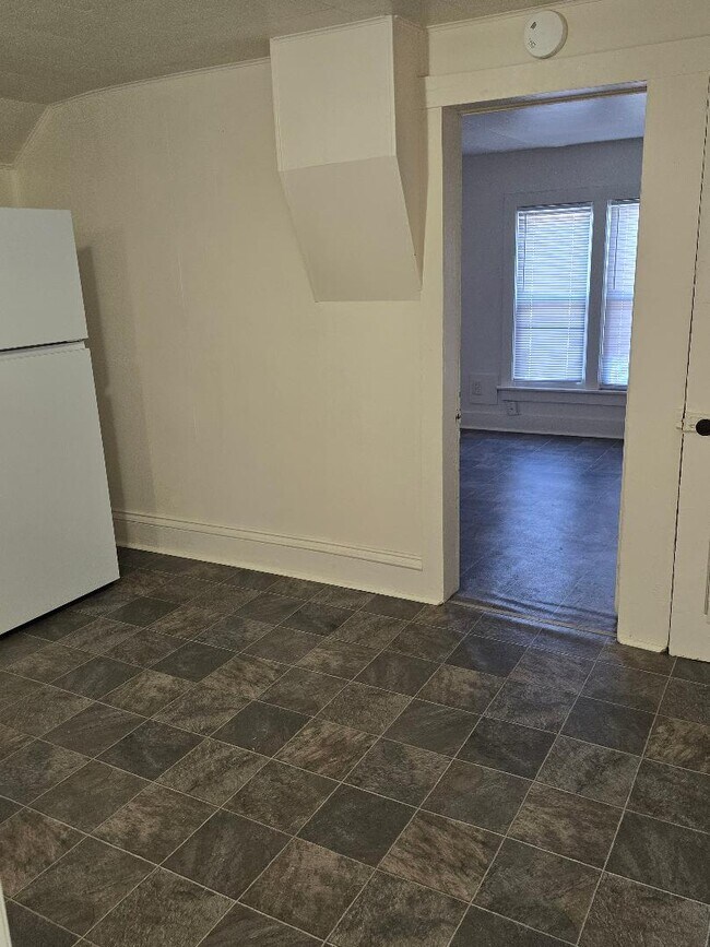 Kitchen looking into bedtoom/living room - 1335 N Church St Unit #2