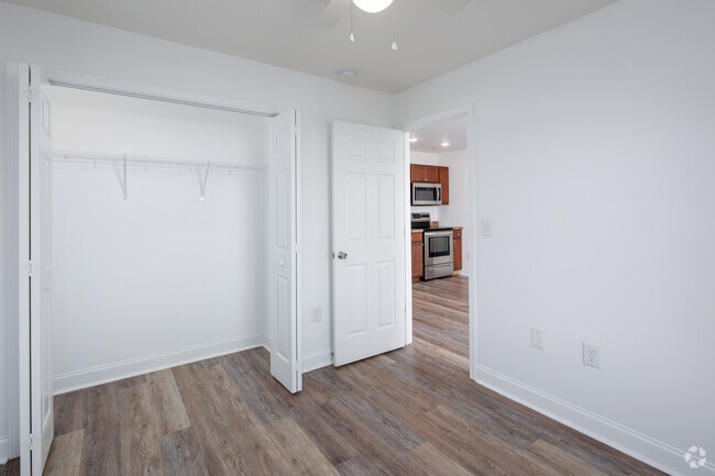 Bedroom 1 showing closet and kitchen.