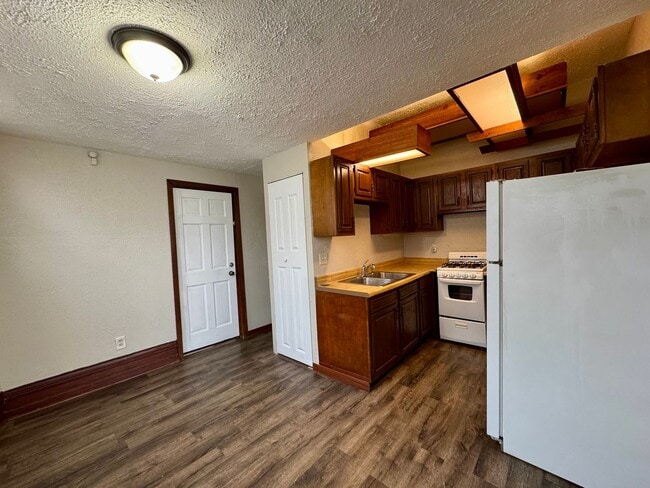 Photo - Racine Cozy 1BR / 1BA Apartment | Off-Street Parking + Appliances +  Walk-In Shower Unit 2 - UPPER #2