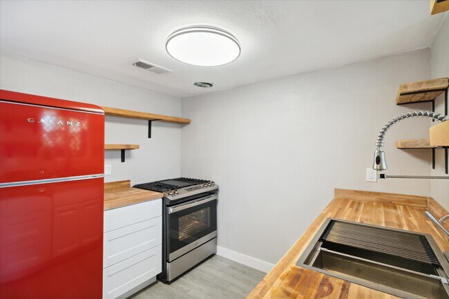 All new appliances, lighting highlight the kitchen - 327 N 16th Ave Unit Apt A