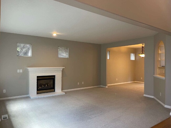 4-Bedroom Happy Valley Home with Large Garage, Spacious Living Areas & Covered Deck