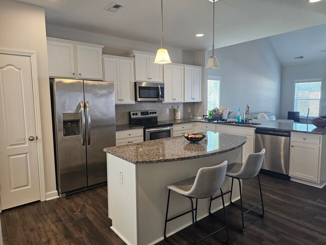 Photo - Like New Home featuring 4 Bedrooms, a Loft, and a fully fenced Yard!