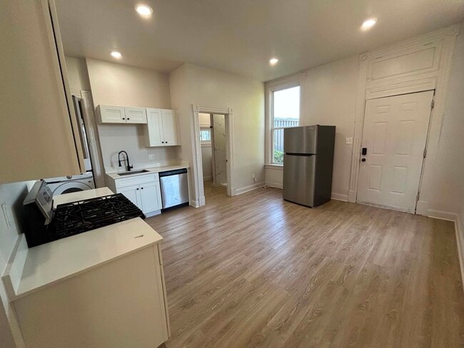 Kitchen with updated appliances - 1408 Russell St Unit 1