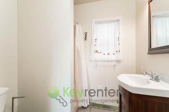 Photo - Stylish Three Bedroom Retreat with fully fenced yard and storage!