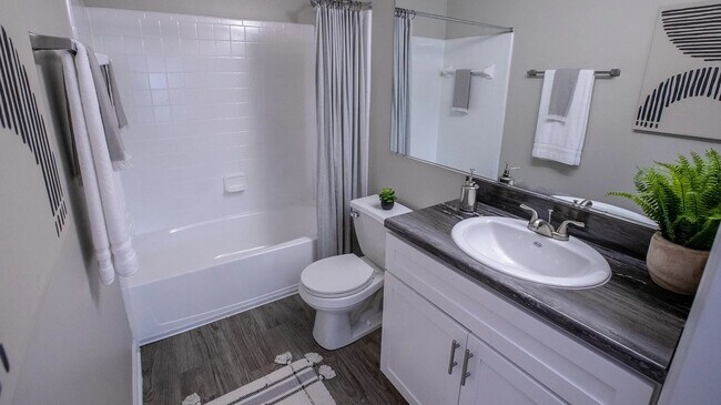 Revitalize your morning routine in our upgraded bathrooms, adorned with striking black fusion countertops and illuminating vanity lighting!