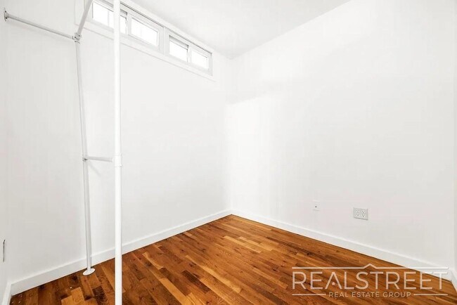 Photo - Modern 2-Bedroom Apartment with Private Balcony in Prime Bushwick Unidad 5A