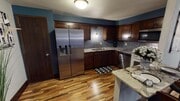 Unit 1 has a decadent kitchen with extensive tile work and high end granite.