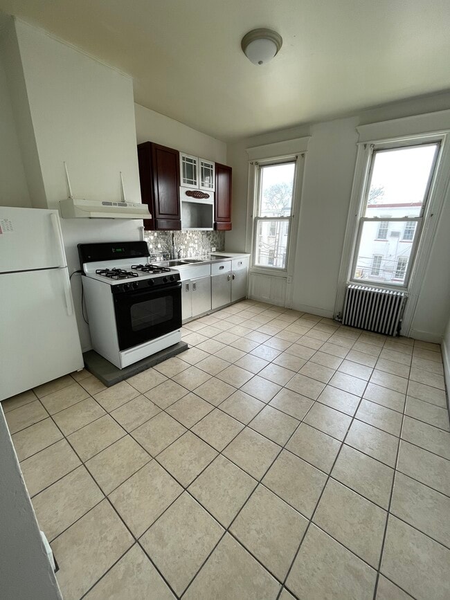 Building Photo - 7329 69th Pl Unit 2R