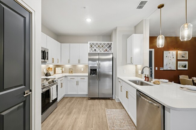 Kitchen with Quartz Countertop and Stainless Steel Appliances - Paros Vineland